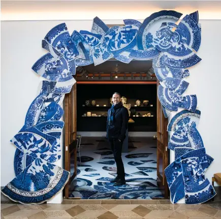  ??  ?? Bouke de Vries stands under the arch he created for the entrance to Sotheby’s new London space