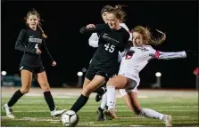  ?? JAMES BEAVER — FOR MEDIANEWS GROUP ?? Parkland’s Alex Marsteller (15) attempts to sweep the ball away from Pennridge’s Lindsey DeHaven (45).