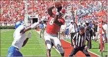  ?? / Athens Banner-Herald, Joshua L Jones ?? Georgia wide receiver Riley Ridley brings in a pass for a touchdown while being defended by Middle Tennessee defensive back Chris Stamps during the first half of the game in Athens, Ga., on Saturday.