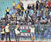  ?? AP ?? ■ Bulgarian fans gesture as the match was stopped twice.