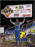  ?? SUBMITTED PHOTO - RICH KEPNER ?? Matt Sheppard hoists the winner’s check after taking the top prize in the Super DIRTCar feature last week at Grandview.