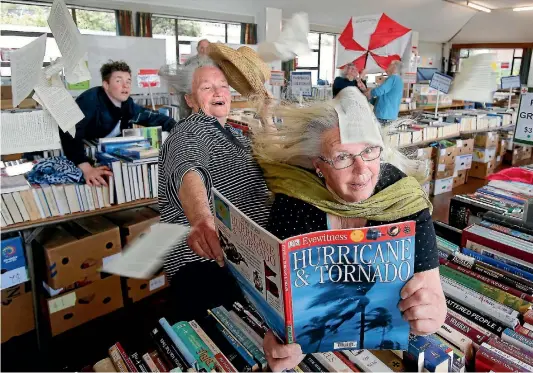  ?? PHOTO: JOHN BISSET/STUFF ?? Prepare to be blown away by this year’s Red Cross book sale... Helping out with the event are, from left, Joshua Dalloway, Margaret Younger and Janette Clarke.