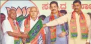  ?? PTI ?? Former JD(S) leader AH Vishwanath (left) joins the BJP in presence of Karnataka CM BS Yediyurapp­a (2L) during a function at the BJP office in Bengaluru on Thursday.
