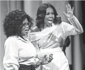  ?? TANNEN MAURY/EPA-EFE ?? Former first lady Michelle Obama is promoting her memoir “Becoming.” She had a book launch with Oprah Winfrey on Tuesday in Chicago.