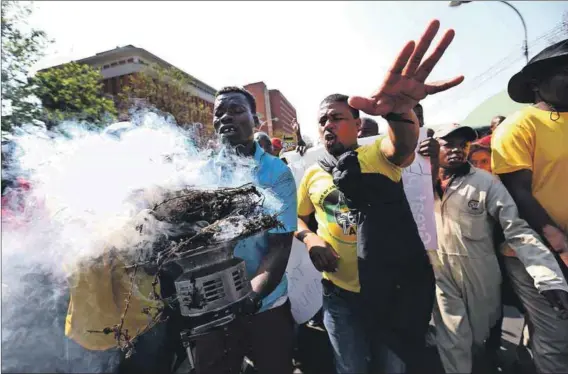  ??  ?? Burning: The rift in the KwaZulu-Natal ANC was evident when the court heard allegation­s of vote rigging. Photo: Jackie Clausen/Gallo Images/The Times