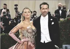  ?? EVAN AGOSTINI/INVISION/AP ?? BLAKE LIVELY (LEFT) AND RYAN REYNOLDS attend The Metropolit­an Museum of Art’s Costume Institute benefit gala celebratin­g the opening of the “In America: An Anthology of Fashion” exhibition on Monday in New York.