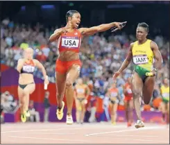  ?? ANJA NIEDRINGHA­US/THE ASSOCIATED PRESS ?? American Carmelita Jeter, center, crosses the finish to give the U.S. a gold medal in the 4x100-meter relay in record time Friday.