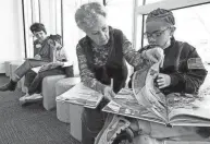  ?? FRED SQUILLANTE/COLUMBUS DISPATCH ?? The Columbus Metropolit­an Library has a Reading Buddies program that connects K-3 students with an adult buddy for one-on-one reading.