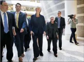  ?? JACQUELYN MARTIN — THE ASSOCIATED PRESS ?? Internatio­nal Monetary Fund (IMF) Managing Director Christine Lagarde, center, and Federal Reserve Chair Janet Yellen laugh as they walk together after speaking at the Institute for New Economic Thinking Conference on Finance and Society on Wednesday...