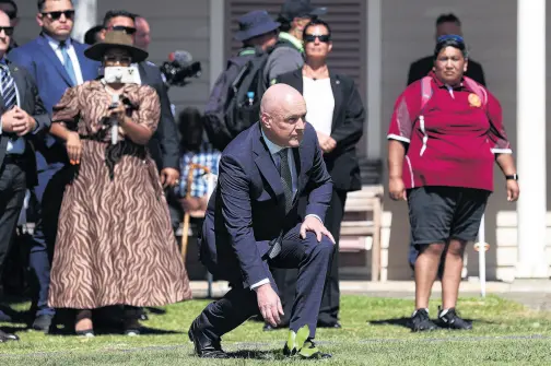  ?? PHOTO: GETTY IMAGES ?? What issues? . . . Christophe­r Luxon accepts a wero during a po¯whiri at Waitangi on Waitangi Day.