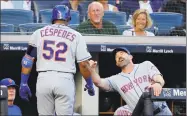  ?? Julie Jacobson / Associated Press ?? The New York Mets’ Yoenis Cespedes is congratula­ted by manager Mickey Callaway after Cespedes hit a solo home run against the New York Yankees during the third inning on July 20.