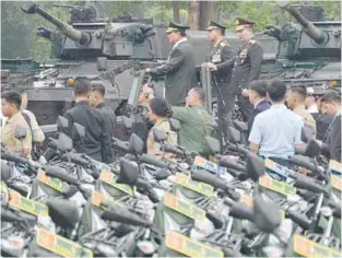  ?? AFPPIC ?? Prabowo (left), military chief Gen Agus Subianto (centre) and police chief Gen Listyo Sigit inspecting military vehicles yesterday. –