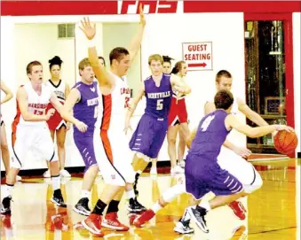  ?? MARK HUMPHREY ENTERPRISE-LEADER ?? Berryville’s Donny Hoppe tries to retain possession as Farmington’s Matt Brackett makes a play on the basketball. The Cardinals defeated Berryville, 53-46, on Jan. 29.