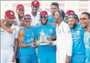  ?? ANI ?? Windies' players celebrate with the Wisden Trophy on Tuesday.