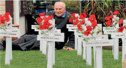  ?? PHOTO: JOHN BISSET/FAIRFAX NZ ?? Stuart Croft is busy readying a field of white crosses with attached poppies that will be displayed on Anzac Day, April 25, at Caroline Bay in Timaru. The crosses are adorned with the names of South Canterbury people who died at war. This year Croft is...