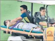  ?? AFP ?? ■ Australian team doctors check on Sri Lanka's Dimuth Karunaratn­e, who was hit by a Pat Cummins bouncer on Saturday.