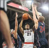  ?? WILLIAM MANCEBO — GETTY IMAGES ?? Calvin Hermanson, left, and Jock Landale defend Gonzaga’s Rui Hachimura on Thursday in Spokane, Wash.