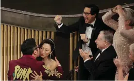  ?? Photograph: Carlos Barría/Reuters ?? Owning the room … the cast and crew of Everything Everywhere All at Once react to winning another Oscar at the 95th Academy Awards.