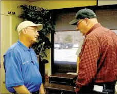  ?? Lynn Atkins/The Weekly Vista ?? Fred Crenshaw brings Bella Vistans to his Fish Camp in Boothville, La., because he loves sharing his love of fishing. He told a recent meeting of the Fly-Tyers, inclduing Gary Henderson, right, about his business that is more like a hobby.