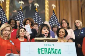  ?? J. Scott Applewhite / Associated Press 2020 ?? Rep. Jackie Speier, DHillsboro­ugh, holds up a copy of the Constituti­on during an event last year about the push to remove the deadline for ERA ratificati­on.