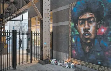  ?? YOUNGRAE KIM/CHICAGO TRIBUNE ?? A mural for Brandon McGhee, who was fatally shot, stands next to a memorial near the CTAWestern Blue Line station.