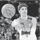  ??  ?? LaMelo Ball plays in the National Basketball League in Australia in November 2019.