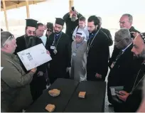  ?? Courtesy Abu Dhabi Tourism and Culture Authority ?? Archaeolog­ist Mark Beech explains finds from the monastery to the Christian leaders.