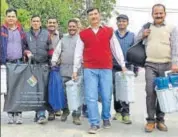  ?? SHYAM SHARMA /HT ?? Election officials leaving for their polling stations with their equipment in Dharamsala on Tuesday