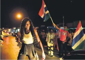  ?? Picture: AFP ?? CRISIS AVERTED. People celebrate in the streets after hearing of the confirmed departure of former Gambian leader Yahya Jammeh.