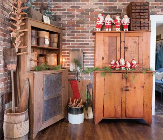 ??  ?? The Ostranders lined an otherwise underwhelm­ing wall with brick veneer to create a distinctiv­e backdrop for kitchen collectibl­es and a whimsical assortment of vintage Santas. The mesh-back veneer panels are similar to sheets of backsplash tile and require a special mortar.