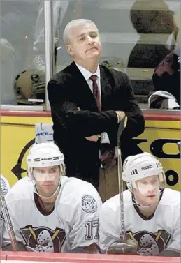  ??  ?? WELL-LIKED AND RESPECTED EXECUTIVE Murray served first as coach and then as general manager of the then-Mighty Ducks from 2001 to 2004. The team advanced to the 2003 Stanley Cup Final.