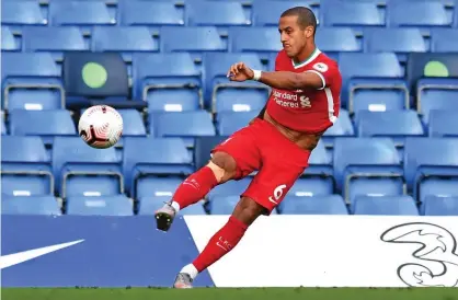  ?? Photograph: Neil Hall/AFP/Getty Images ?? Thiago Alcântara warming up at Stamford Bridge before making his Liverpool debut against Chelsea on 20 September.