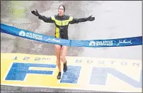  ??  ?? Desiree Linden of the United States crosses the finish line as the winner of the 2018 and 122nd Boston Marathon for Elite Women’s race with a time of 2:39:54 on April 16 in Boston, Massachuse­tts. Her personal best finish was previously second place in...