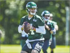  ?? Mark Brown / Getty Images ?? Jets quarterbac­k Sam Darnold drops back to pass during minicamp on Tuesday in Florham Park, N.J.