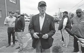  ?? CAROLYN KASTER/AP ?? President Joe Biden speaks with members of the media after a briefing in Rolling Fork, Miss., Friday. Biden traveled to Rolling Fork to survey the damage after a deadly tornado and severe storm moved through the area. Mississipp­i Gov. Tate Reeves is second from left.