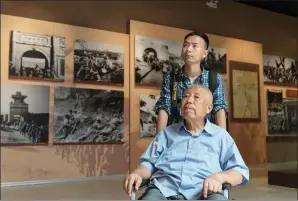  ?? PROVIDED TO CHINA DAILY ?? Zhu Wenbin and his grandson, Zhu Zhe, visit a museum in memory of the Chinese war of liberation in the Inner Mongolia autonomous region.