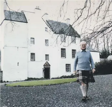  ??  ?? 0 Sir William Macpherson at his home, Newton Castle, Blairgowri­e