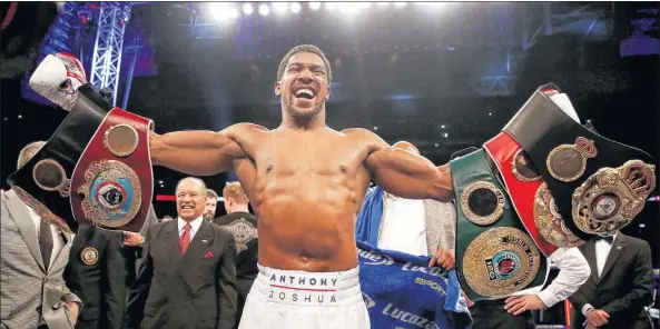  ?? AP PHOTO ?? Anthony Joshua celebrates defeating Alexander Povetkin to retained his WBA, IBF, and WBO heavyweigh­t boxing titles, Saturday, Sept. 22, 2018, at Wembley Stadium in London.