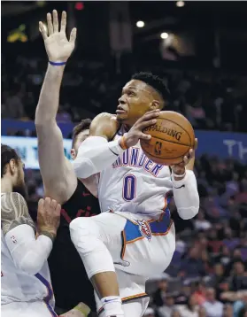  ?? AP FOTO ?? TRIPLE-DOUBLE MACHINE. OKC Thunder star Russell Westbrook drives to the basket against Yusuf Nurkic. Westbrook logged his 10th straight triple-double.