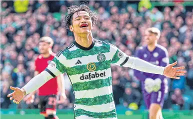  ?? ?? Reo Hatate celebrates the first goal at Celtic Park yesterday.