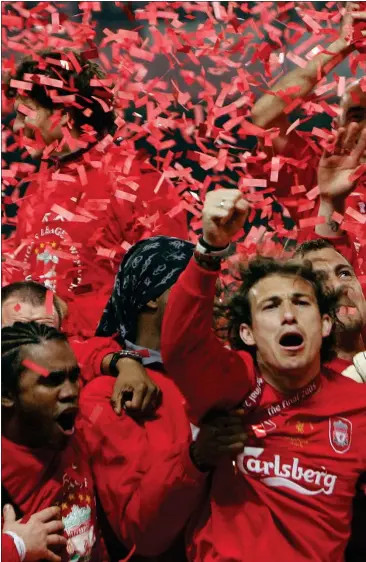  ??  ?? Steven Gerrard and his Liverpool team-mates celebrate winning the Champions League trophy in 2005 after overcoming AC Milan in Istanbul following a dramatic comeback