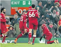  ?? Picture: Reuters ?? Liverpool’s Sadio Mane, right, celebrates with teammates after scoring against Newcastle at Anfield last night.