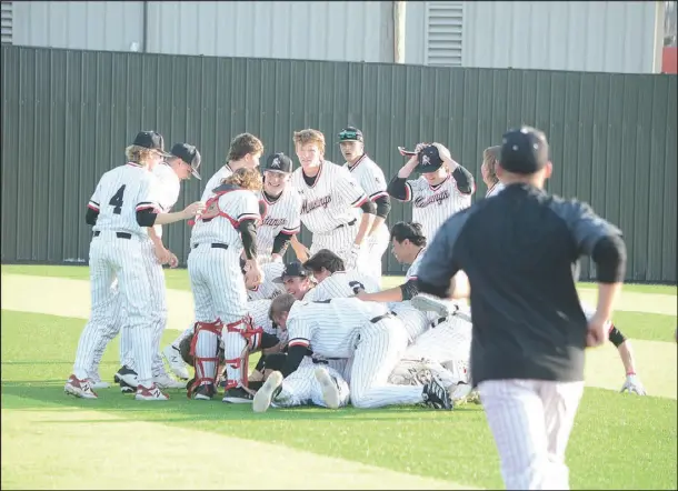  ?? Bennett Horne/Special
to McDonalD county preSS ?? the McDonald County Mustangs celebrate their 2-1 walk-off win tuesday over the visiting Webb city cardinals.