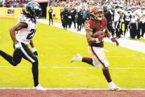  ?? ALEX BRANDON/AP ?? Washington Football Team running back Jaret Patterson, right, a Pallotti graduate, adding his second rushing touchdown of the season in a 20-16 loss to the Philadelph­ia Eagles.