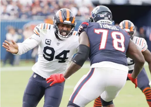  ?? KAMIL KRZACZYNSK­I/AP ?? Bears defensive end Robert Quinn has only one sack in four games after breaking the team record for sacks in a season in 2021 with 18½.