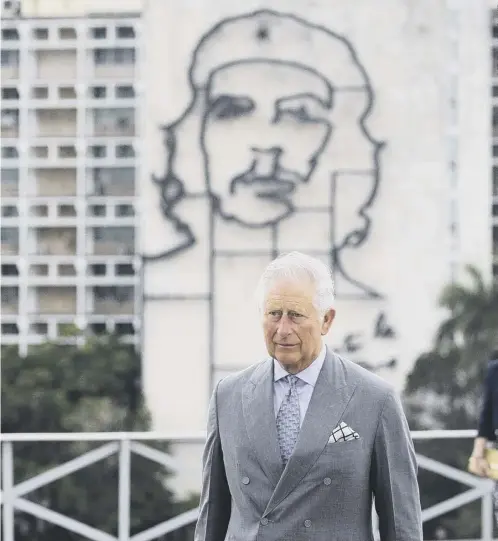  ??  ?? 0 A giant mural of Che Guevara looms over Prince Charles in Havana’s Revolution Square as the historic royal visit to Cuba began last night