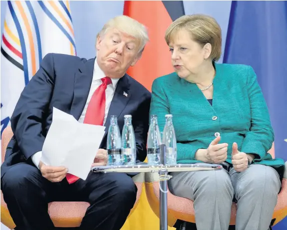  ??  ?? US President Donald Trump and German Chancellor Angela Merkel attend a panel discussion titled ‘Launch Event Women’s Entreprene­ur Finance Initiative’