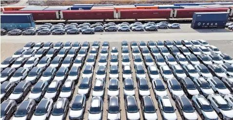  ?? ?? Vehicles meant for export are seen at Taicang Port in east China’s Jiangsu Province.
— CFP