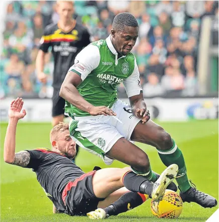  ??  ?? Hibernian’s Marvin Bartley, right, in action with Partick Thistle’s Danny Devine.