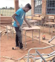  ?? | SUPPLIED ?? ELECTION Lethiba, 25,
repaired 135 desks at Fetakgomo High School in Limpopo just before the start of the new term
today.